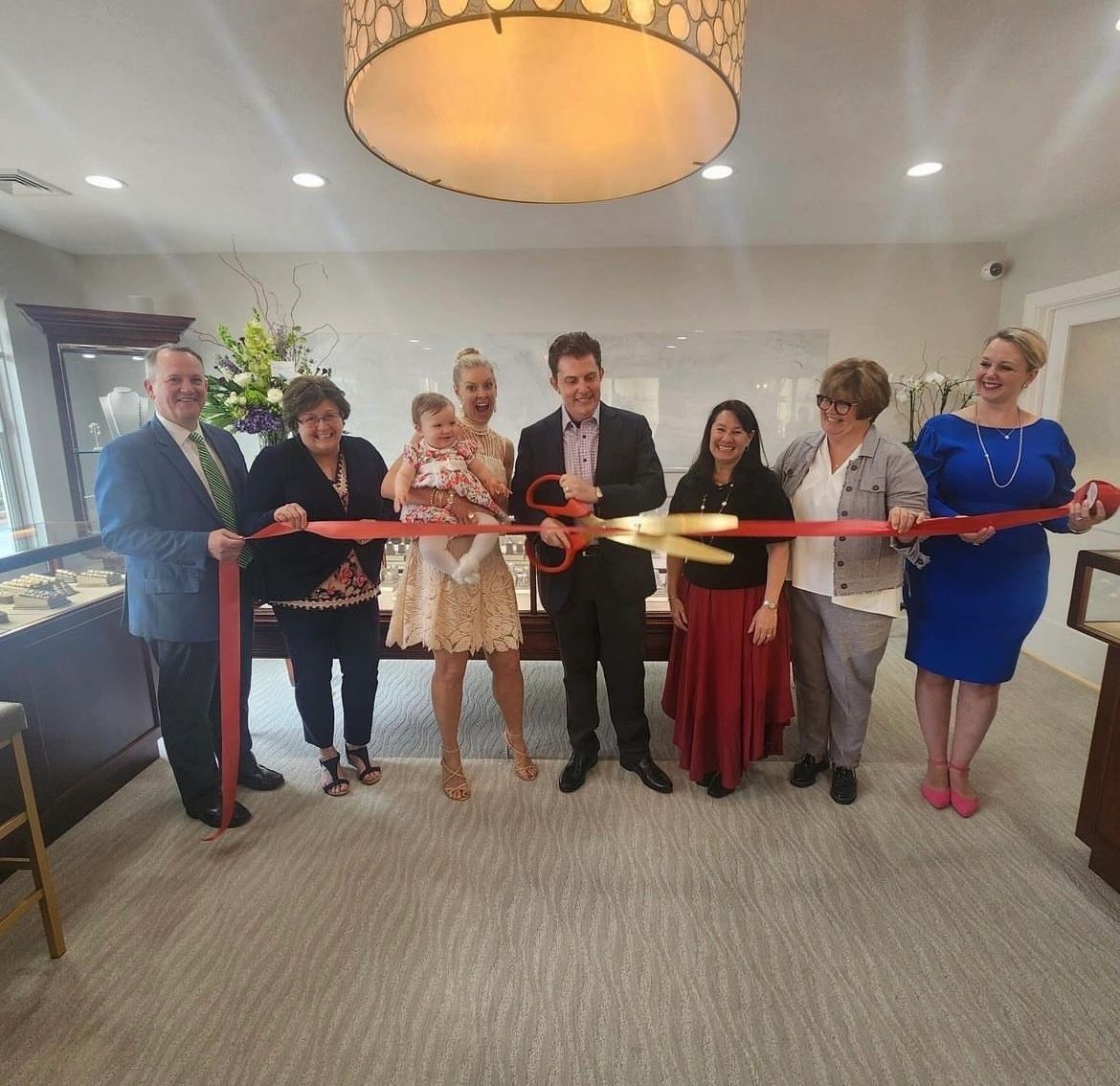 Photo L-R: Tim Murray (president of Worcester Chamber), Doreen Goodrich (district director for Senator Mike Moore),Melissa and Michael Pope with daughter Rosalynd, Jamie Rotman, Candi Mero Carlson (Worcester city councilor) and Carly Albino (photo courtesy)