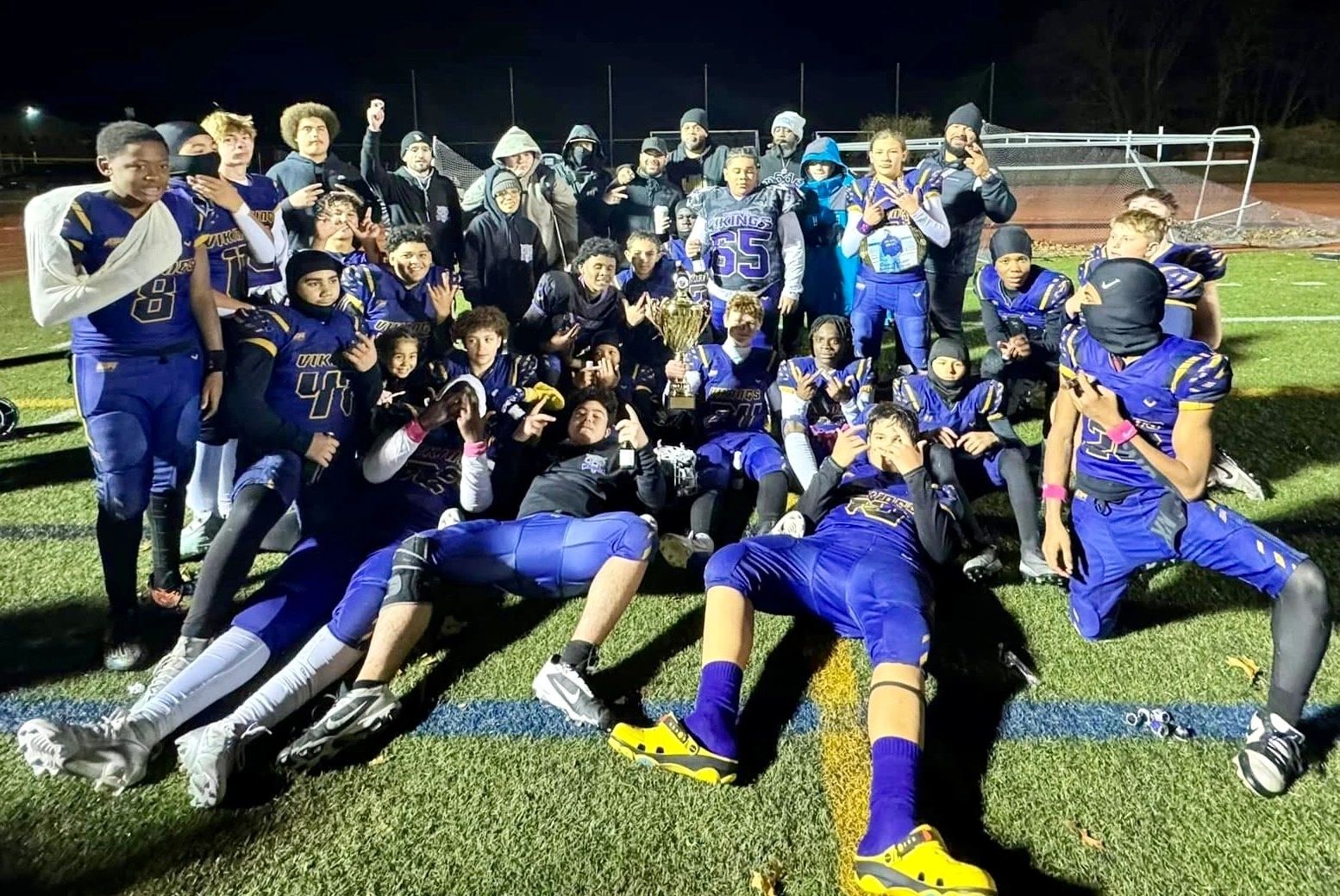 The U13 Worcester Vikings pose with the Division 2 Super Bowl trophy (photo courtesy)