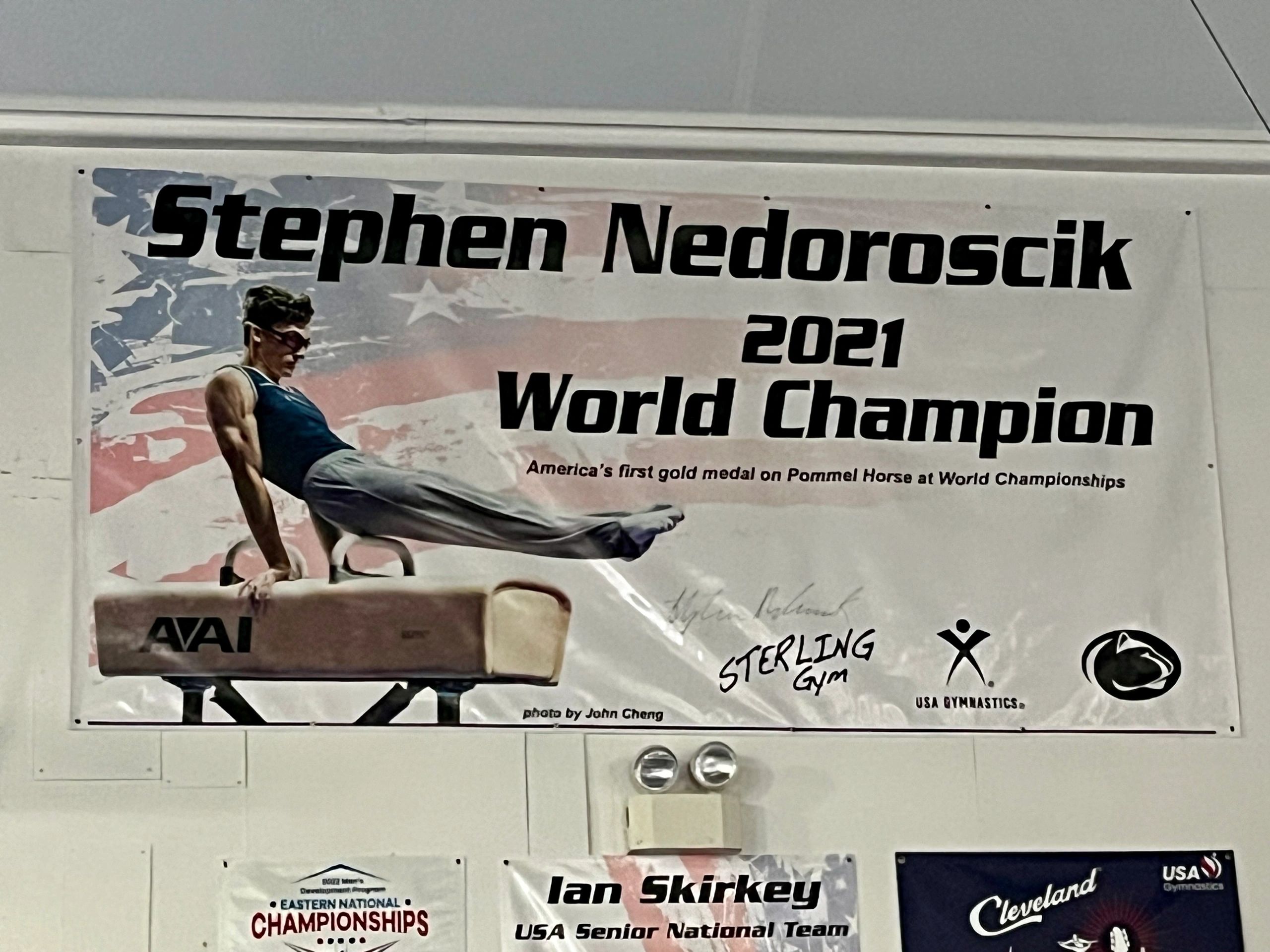 A large poster of Nedoroscik hangs on the wall celebrating his 2021 world championship in pommel horse, America’s first gold medal in that event.
