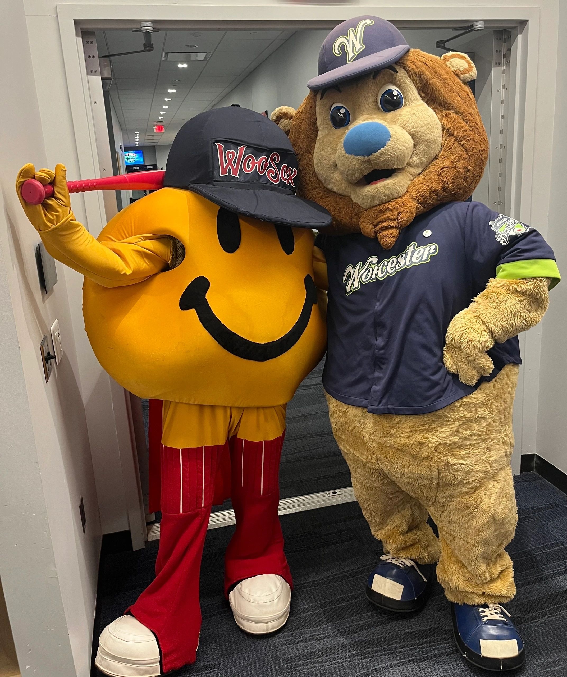 Mascots Smiley Ball and Jake hang "backstage" (photo credit: Mike Vigneux)