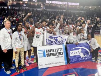 North High celebrates with the team trophy (photo by Mike Vigneux)