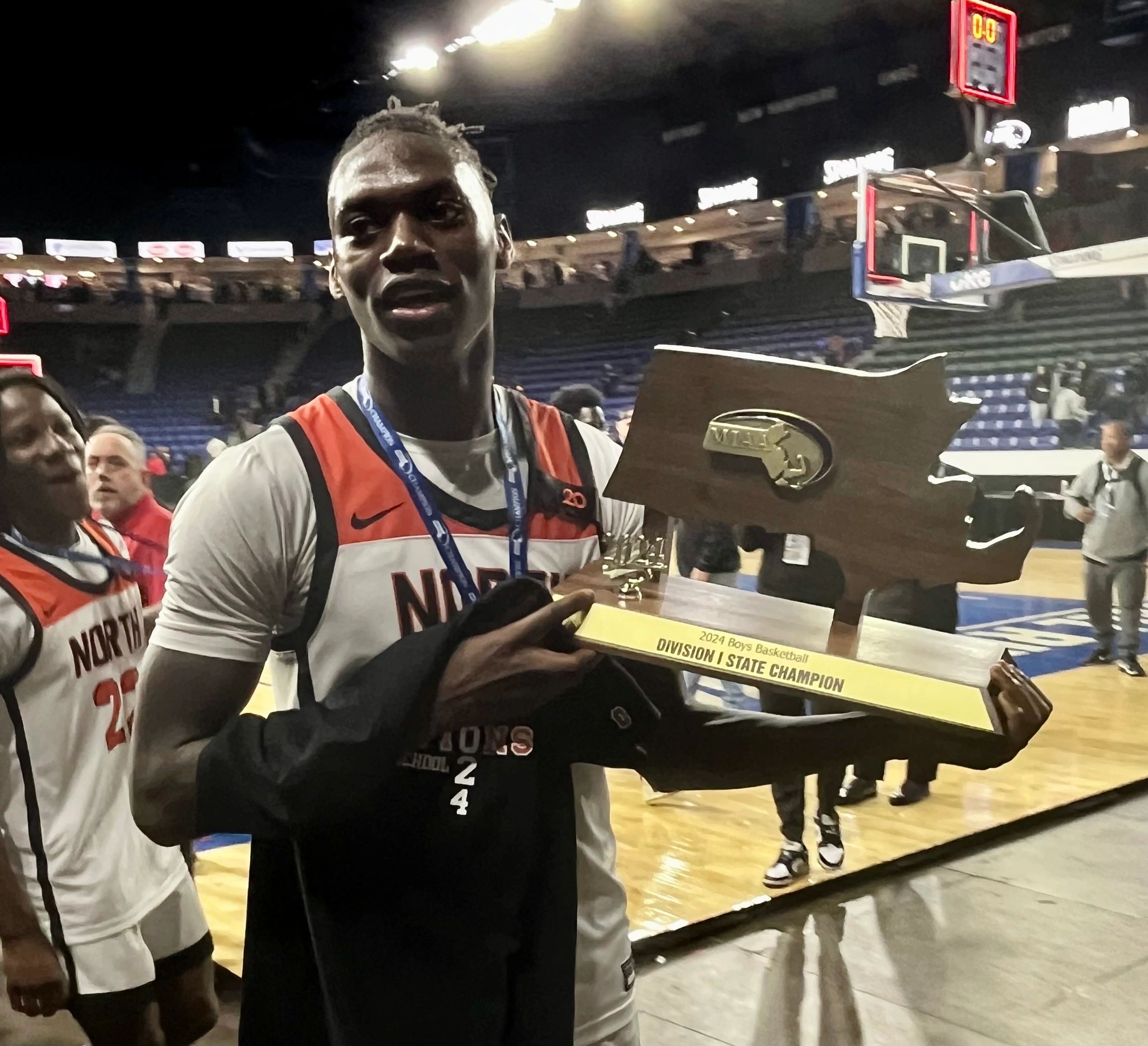 Senior Joe Okla with the championship trophy  (photo by Mike Vigneux)