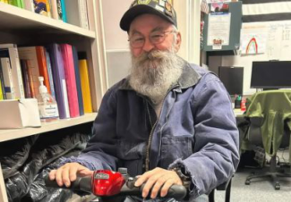 Tom Vincent with the scooter gifted to him by Quinsigamond Community College Veteran Affairs (photo courtesy of Tom Vincent)