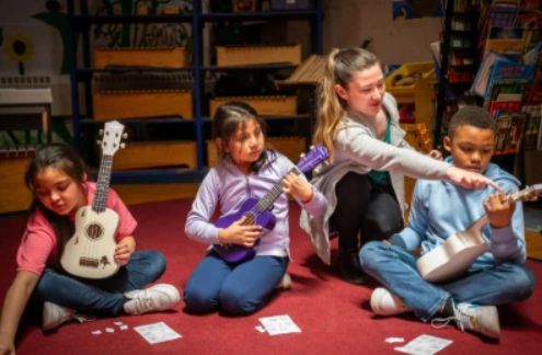 Students learning to play the ukulele at Pakachoag Music School