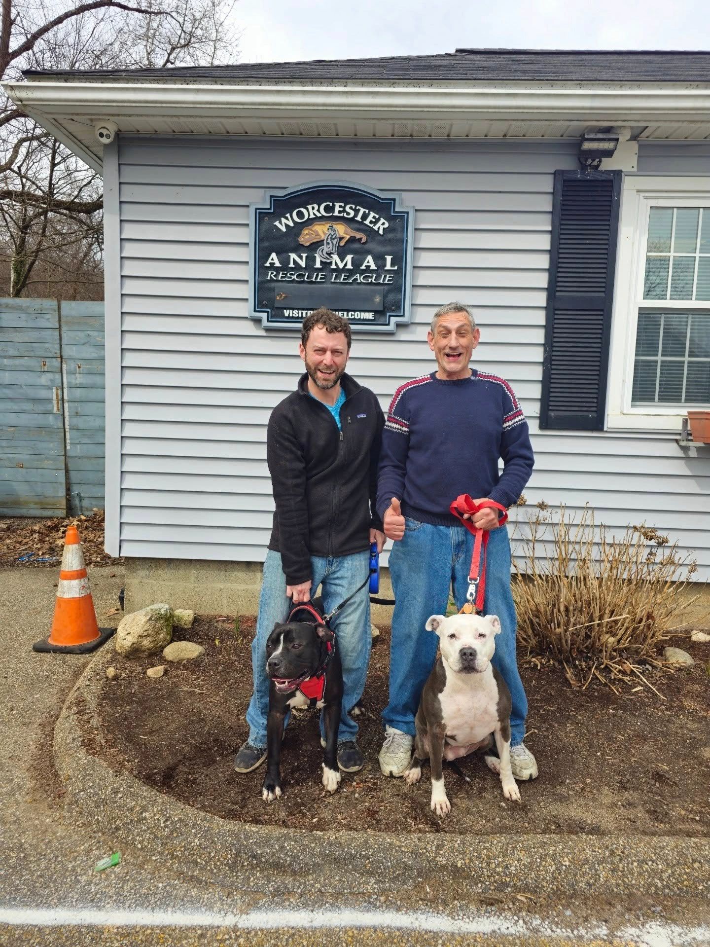 Adopters pose with their new forever friends, adopted from WARL in May (photo credit: WARL)