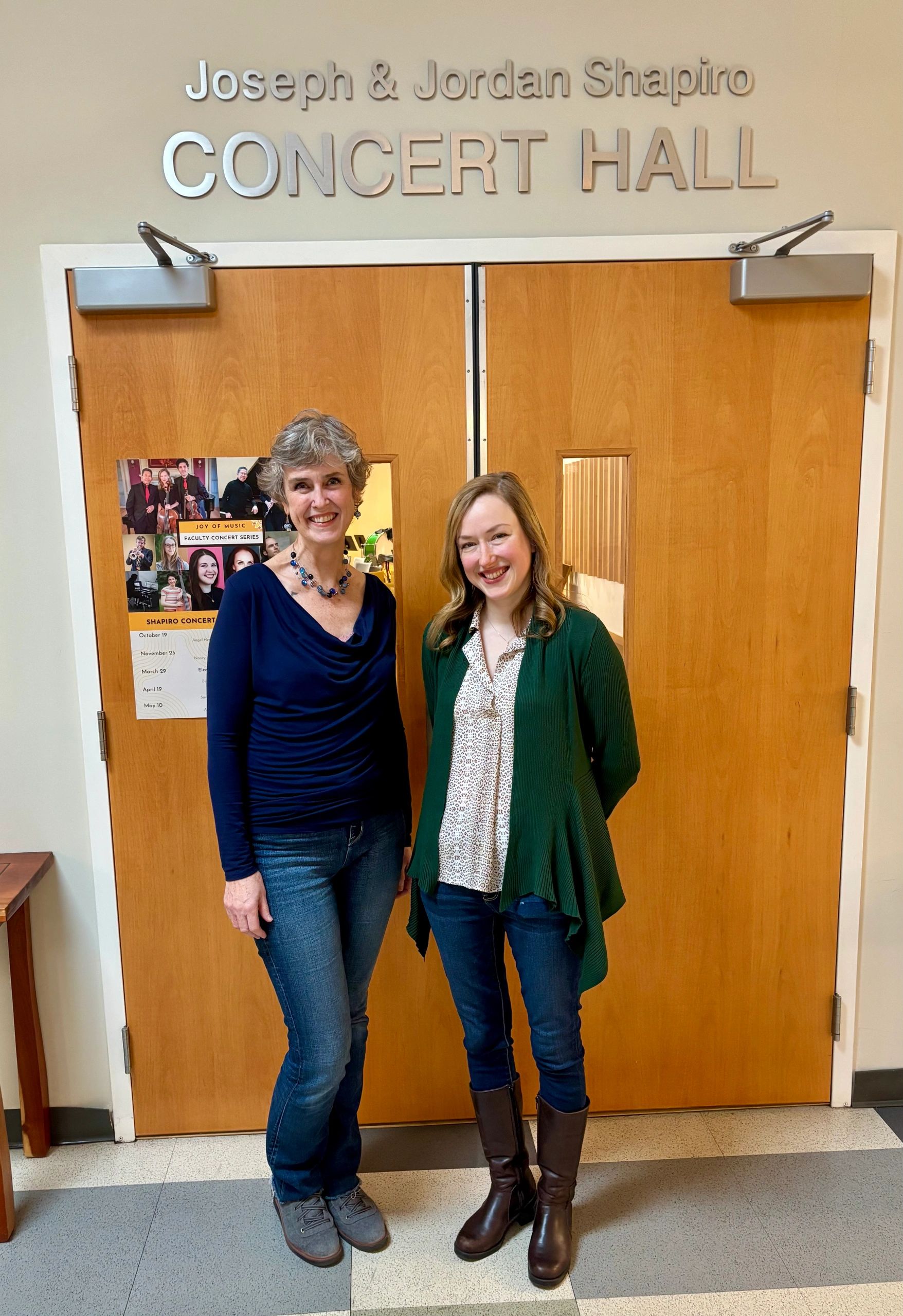 Jennifer Griffin Gaul, JOMP executive director, and  Caroline Reiner-Williams, JOMP associate director, stand outside the Shapiro Concert Hall at the Joy of Music Program (photo by Bill Doyle)