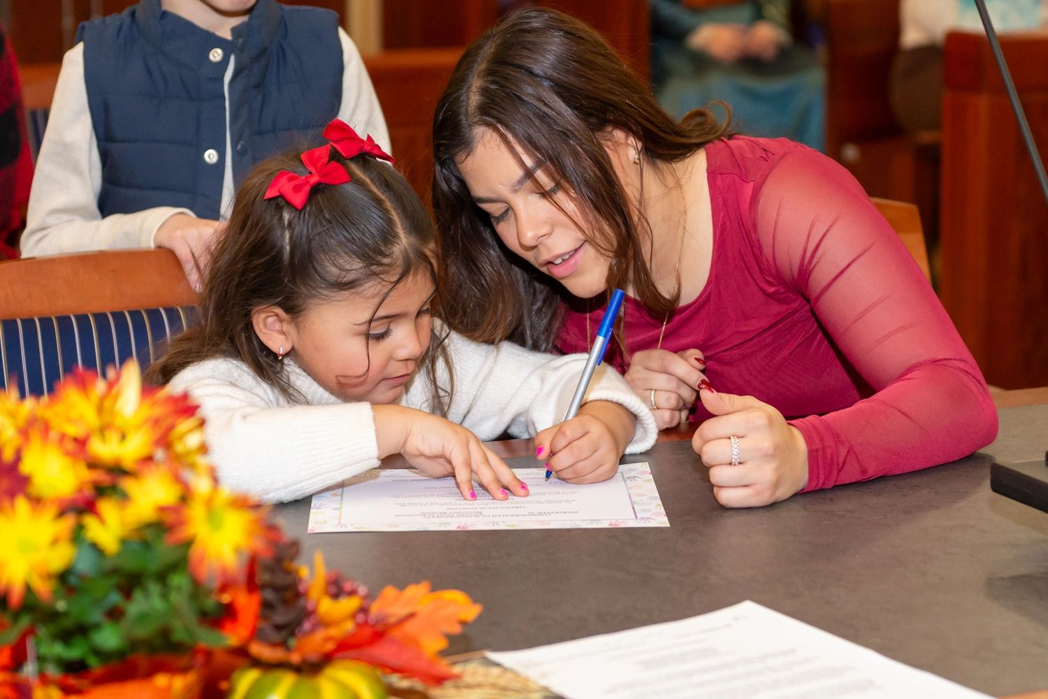 Signing the official paperwork at National Adoption Day celebration in Worcester (photo courtesy Phil Smith Photography)