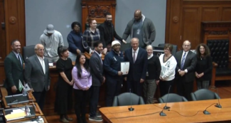 Legendary Legacies founder Ron Waddell Jr. poses with city councilors at its Dec. 16 meeting