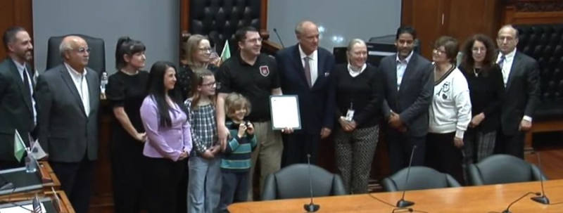 City honors firefighter for sock-footed rescue