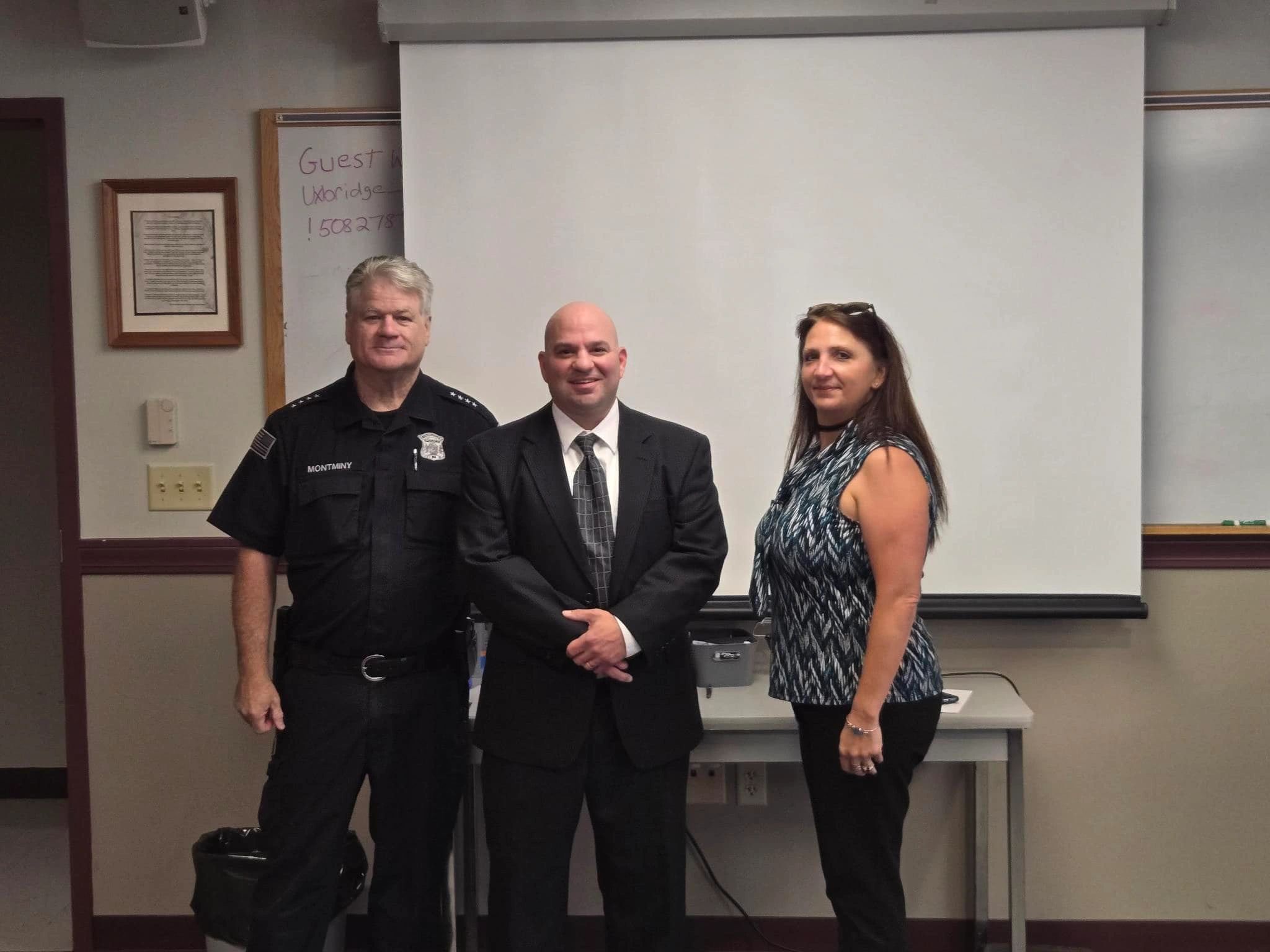 Officer Stephen LaPorta (middle) pictured here in 2024 celebrating his promotion to full-time patrolman (photo credit: Uxbridge Police Department)
