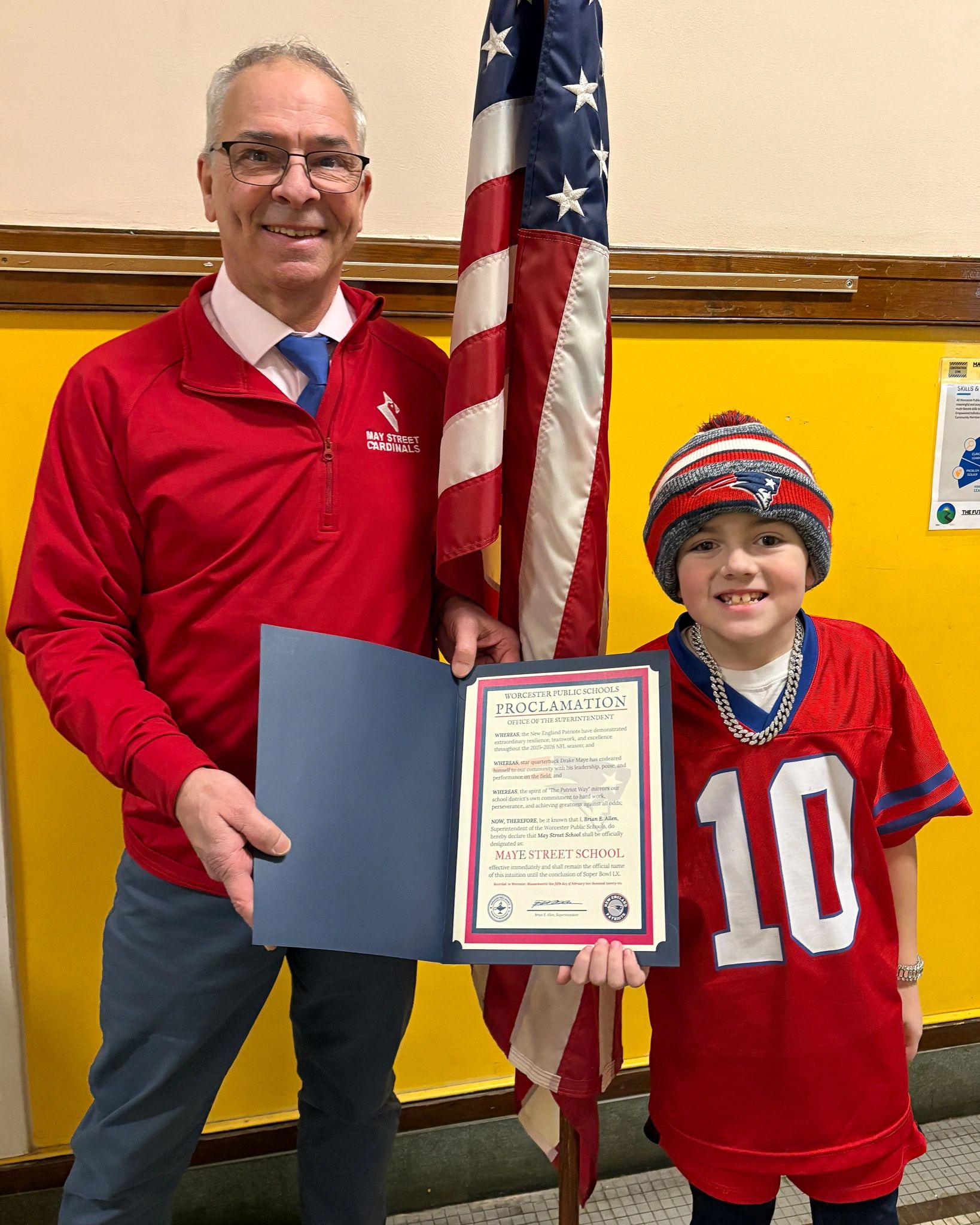 Principal Luke Robert and a student hold the declaration presented to May Street School from the city (photo credit: City of Worcester)