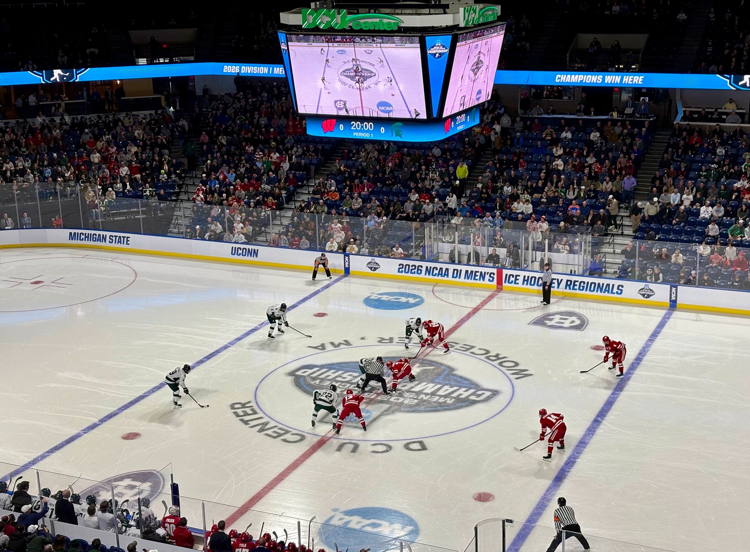 The puck drops in an NCAA Division I Men’s Ice Hockey Regional Final between Michigan State and Wisconsin on March 28 at Worcester’s DCU Center (photo by Mike Vigneux)