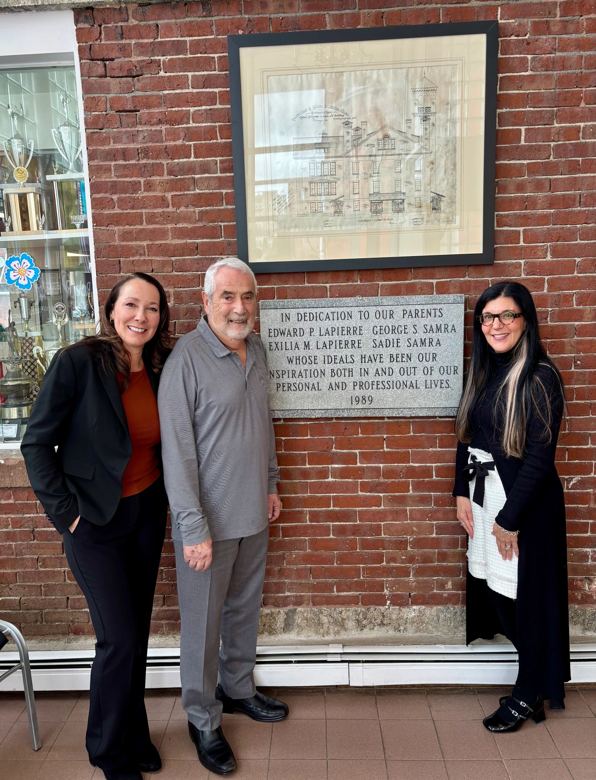 From left, Tracy Casey, Robert Lapierre and Debra Cooke stand outside the Rob Roy Academy on Pleasant Street (photo by Bill Doyle)